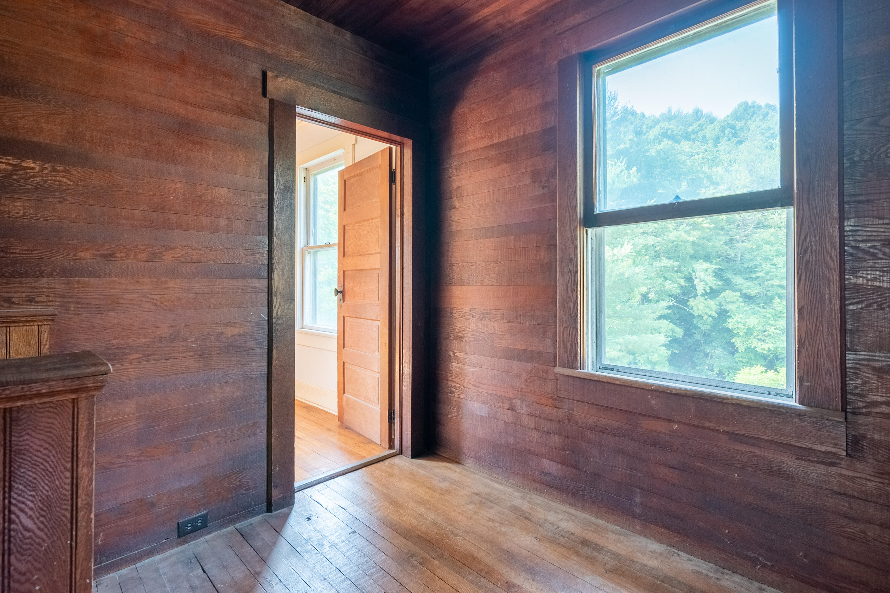 415 Reed Hill Road Northwest Floyd, VA 24091 - Photo 46 of 69 a view of an empty room with wooden floor and a window