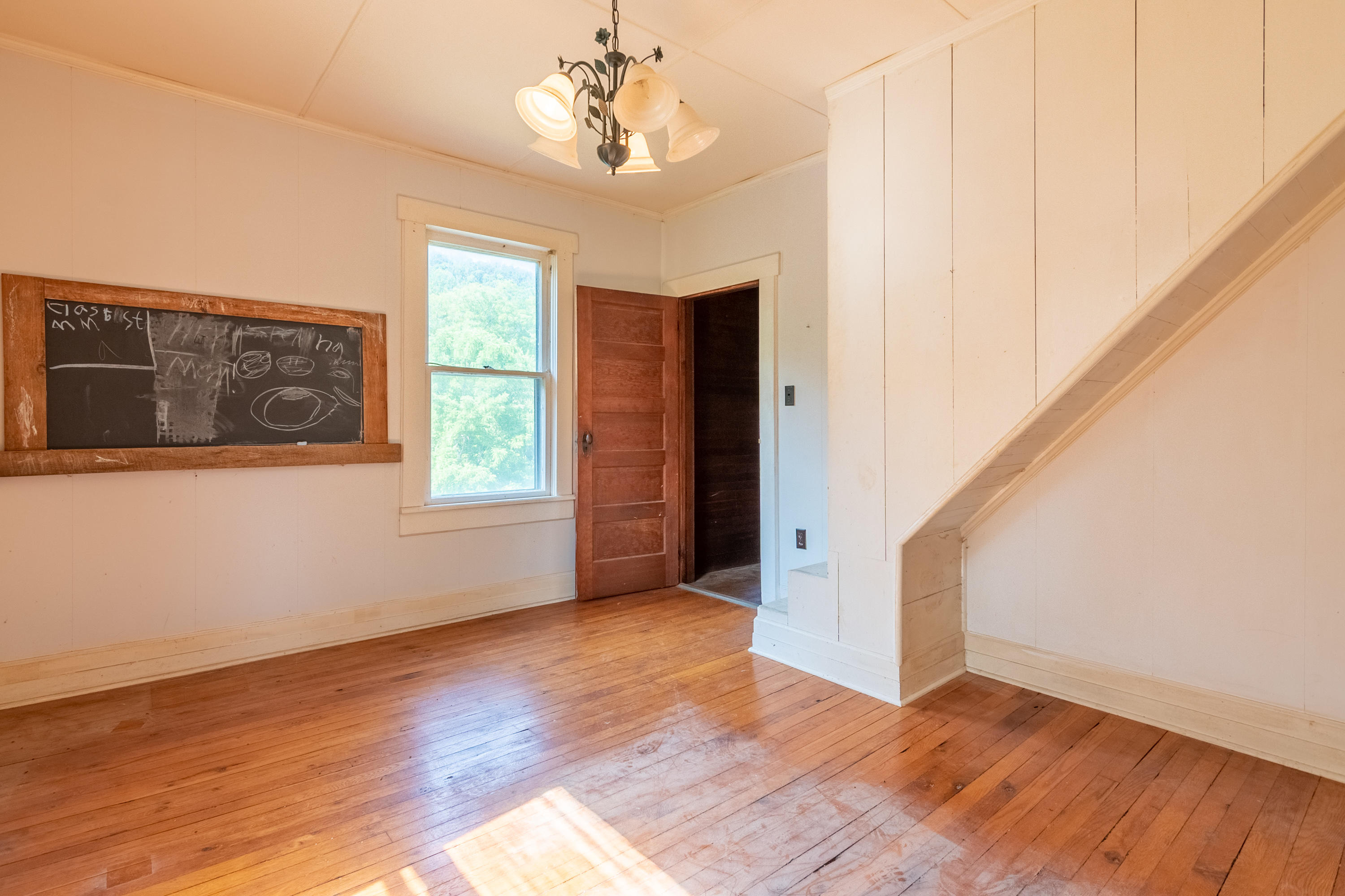 415 Reed Hill Road Northwest Floyd, VA 24091 - Photo 49 of 69 a view of an empty room with wooden floor and a window
