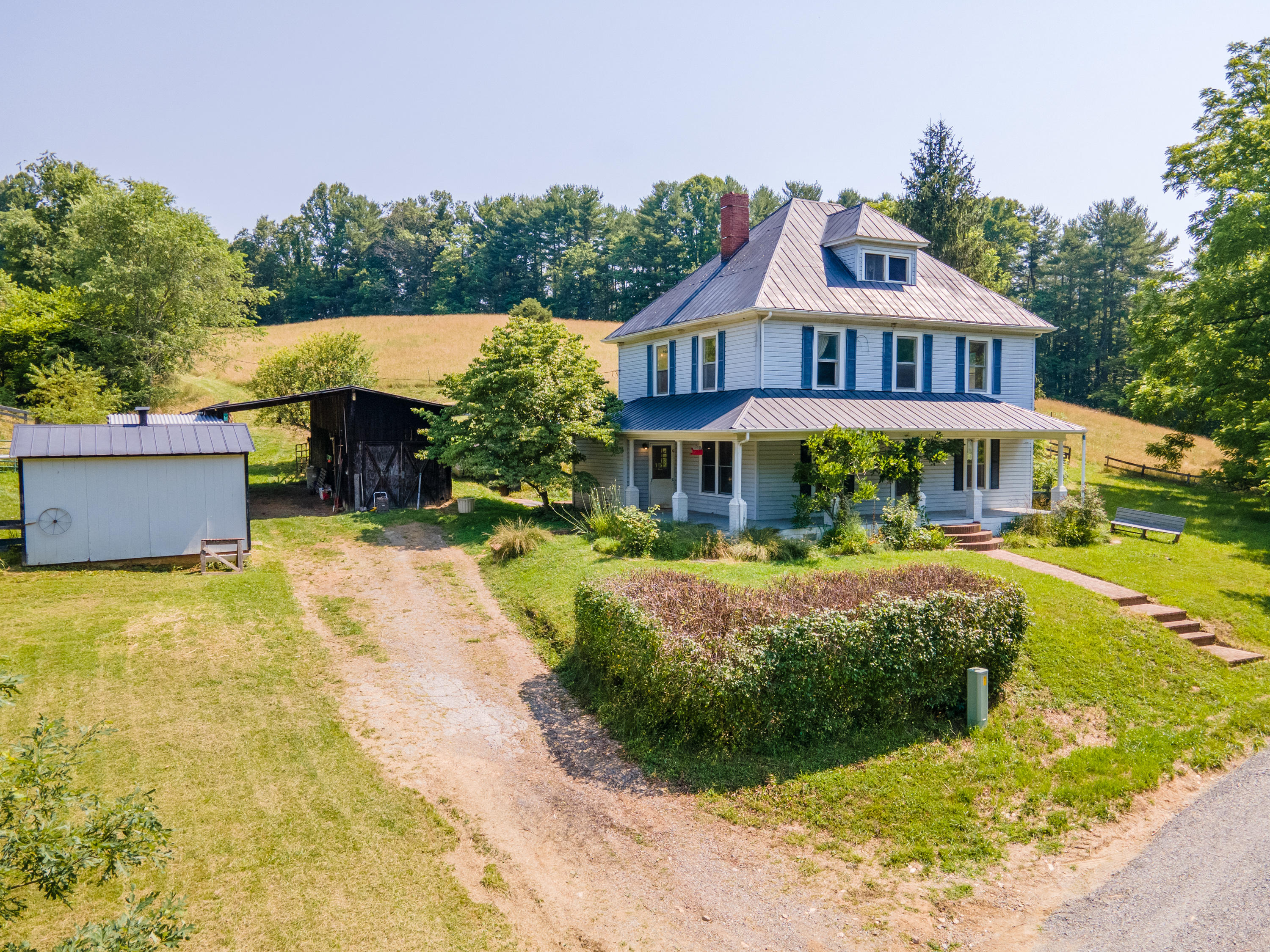 415 Reed Hill Road Northwest Floyd, VA 24091 - Photo 6 of 69 a front view of a house with a yard