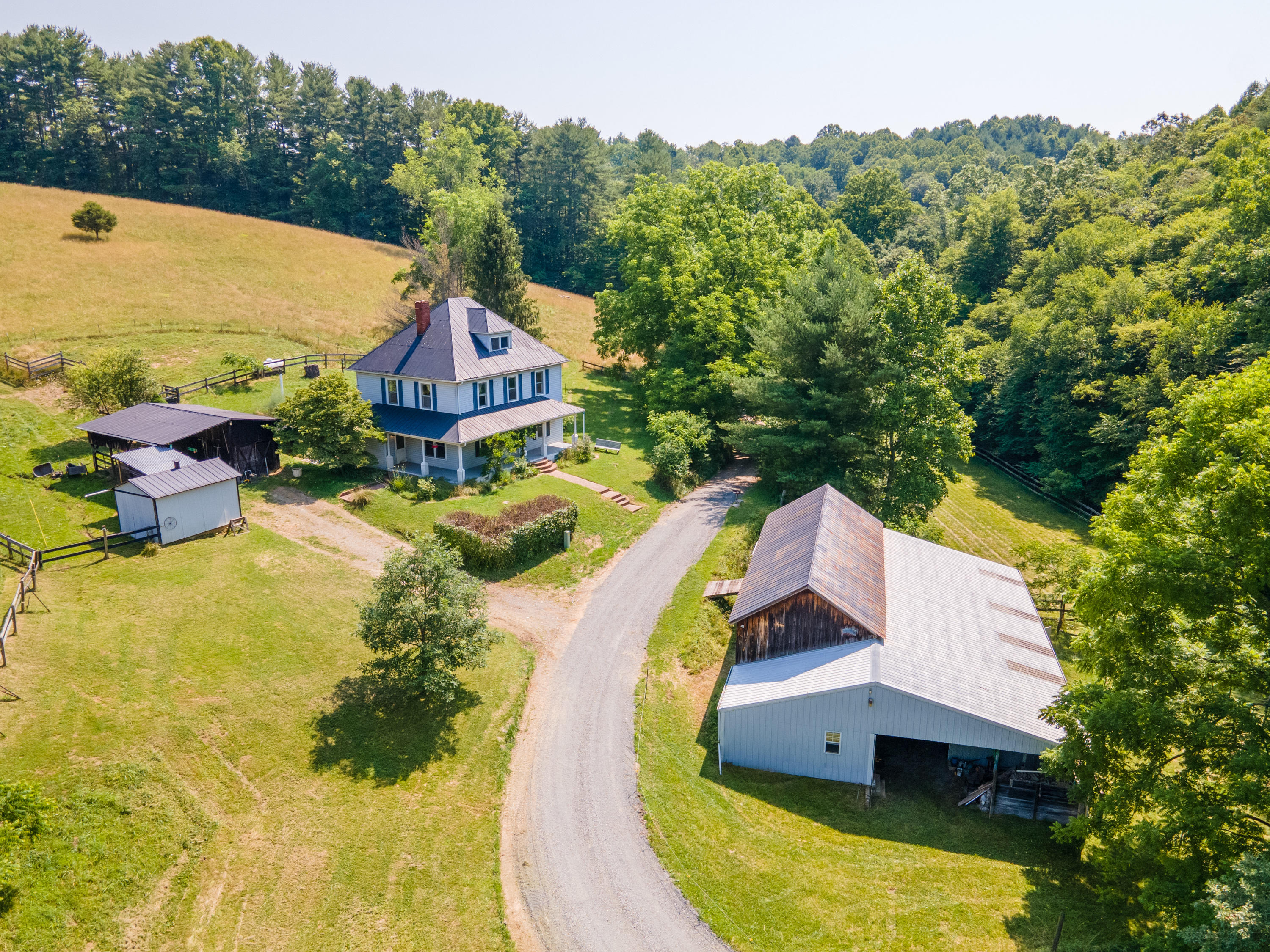 415 Reed Hill Road Northwest Floyd, VA 24091 - Photo 7 of 69 an aerial view of a house with swimming pool and large trees