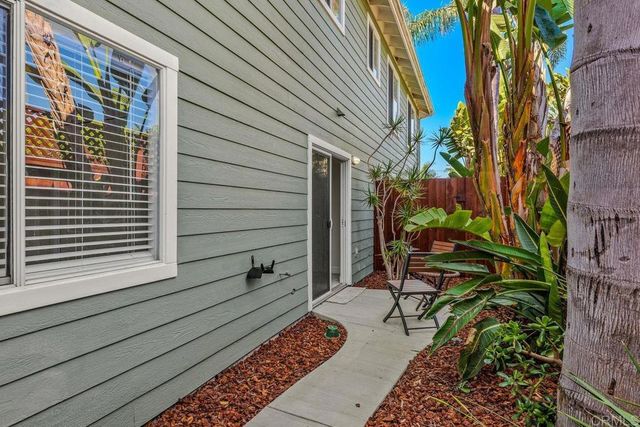 a view of a swimming pool with outdoor seating space