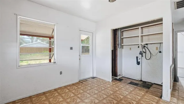 a bathroom with a toilet and a shower curtain