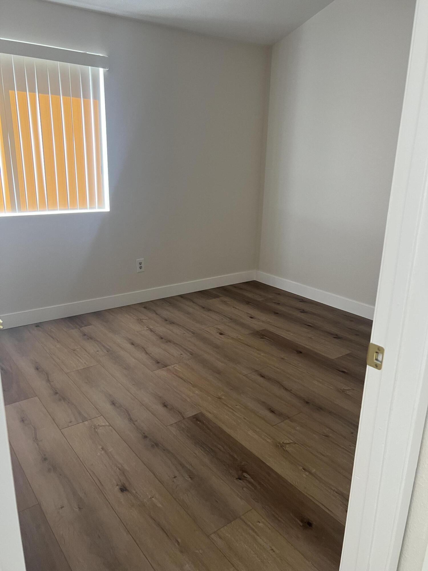 79307 South Sunset Ridge Drive La Quinta, CA 92253 - Photo 17 of 32 wooden floor in an empty room