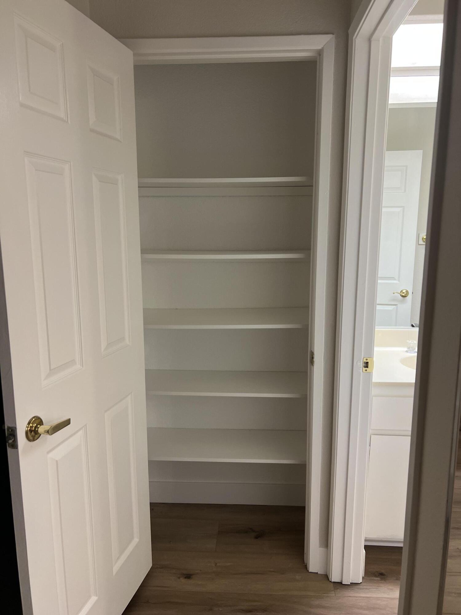 79307 South Sunset Ridge Drive La Quinta, CA 92253 - Photo 18 of 32 a view of walk in closet with empty racks