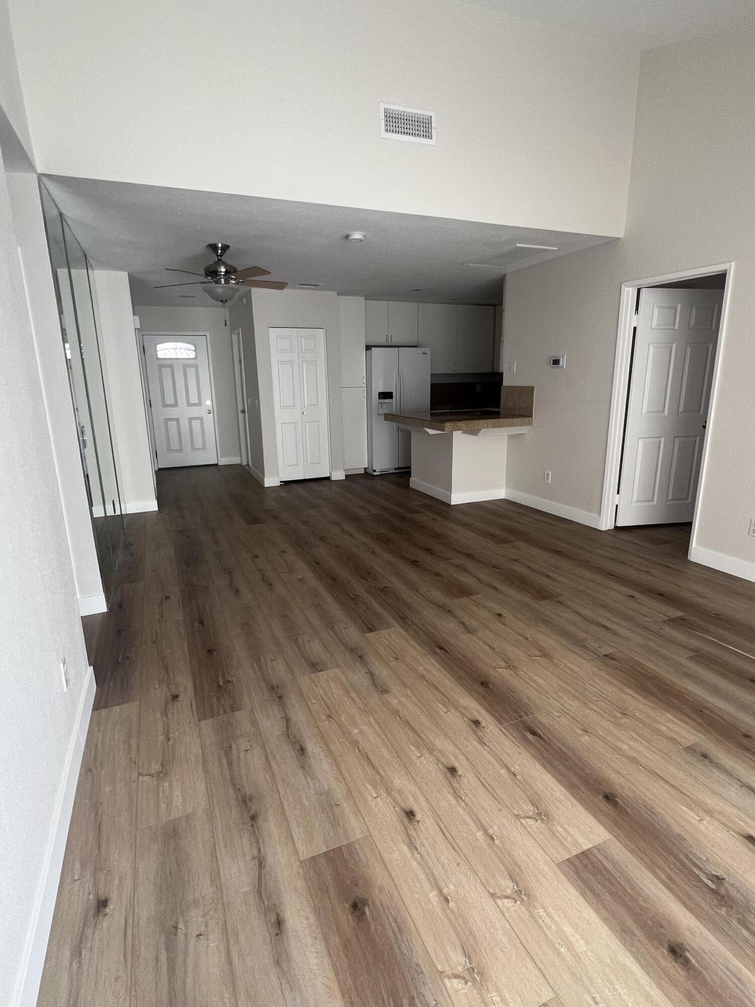 79307 South Sunset Ridge Drive La Quinta, CA 92253 - Photo 23 of 32 a view of empty room with wooden floor