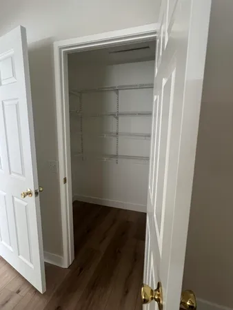 a view of wooden floor in an empty room