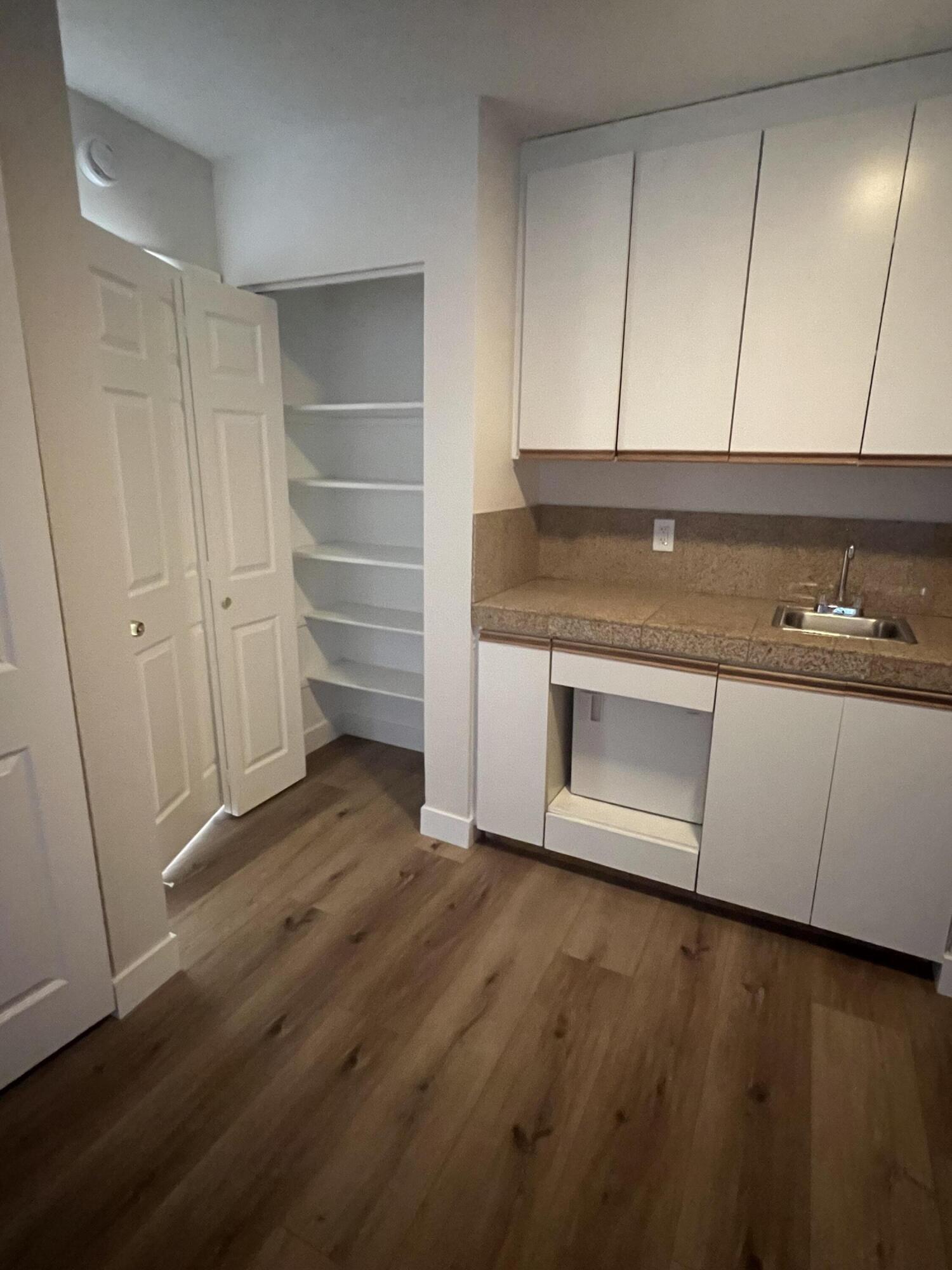 79307 South Sunset Ridge Drive La Quinta, CA 92253 - Photo 27 of 32 a view of an empty room with wooden floor