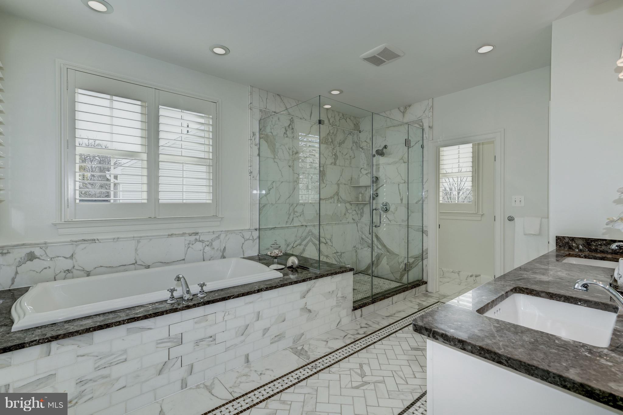 3007 North Rochester Street Arlington, VA 22213 - Photo 23 of 43 a bathroom with a granite countertop sink and a bathtub