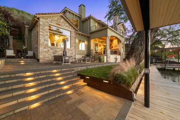 a kitchen with stainless steel appliances granite countertop a stove and a refrigerator