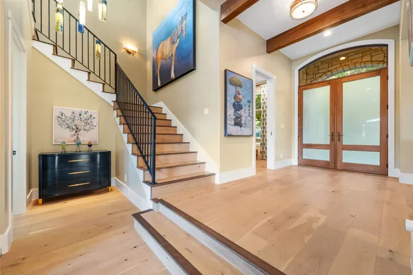 a spacious bedroom with a large bed and a window