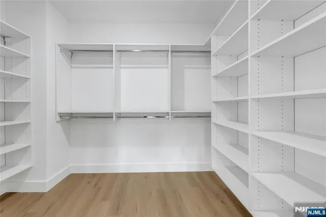 a view of a room with shelf on the wall