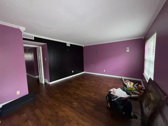 a bathroom with a granite countertop sink and mirror