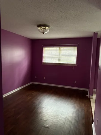 a kitchen with stainless steel appliances granite countertop a stove and a microwave