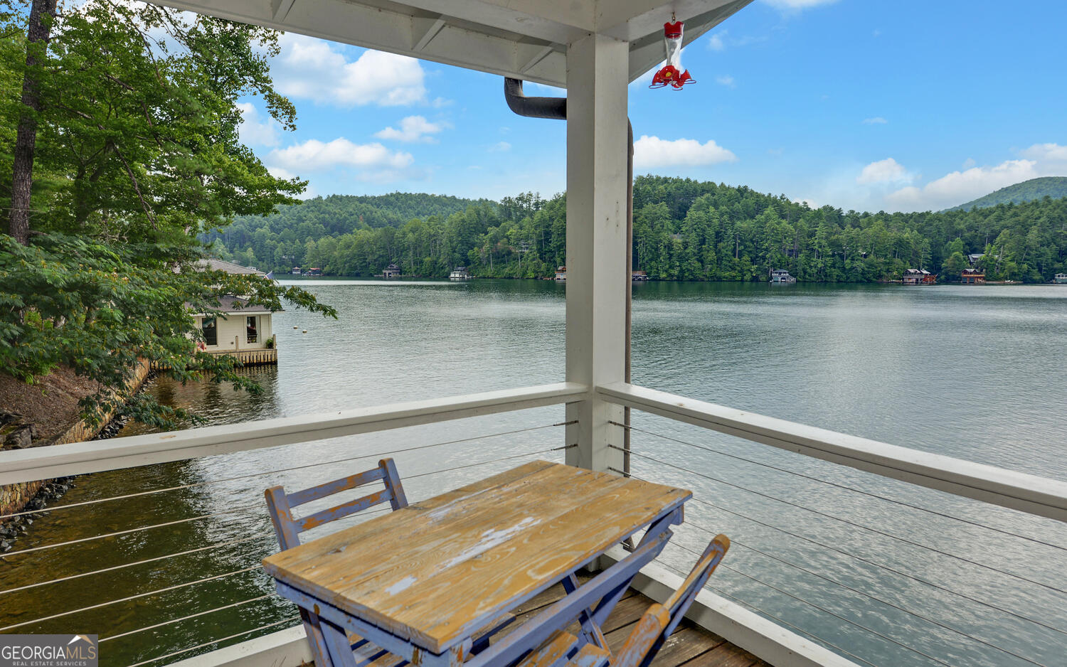 3540 Lake Rabun Road Lakemont, GA 30552 - Photo 74 of 81 a view of a balcony with two chairs and a table