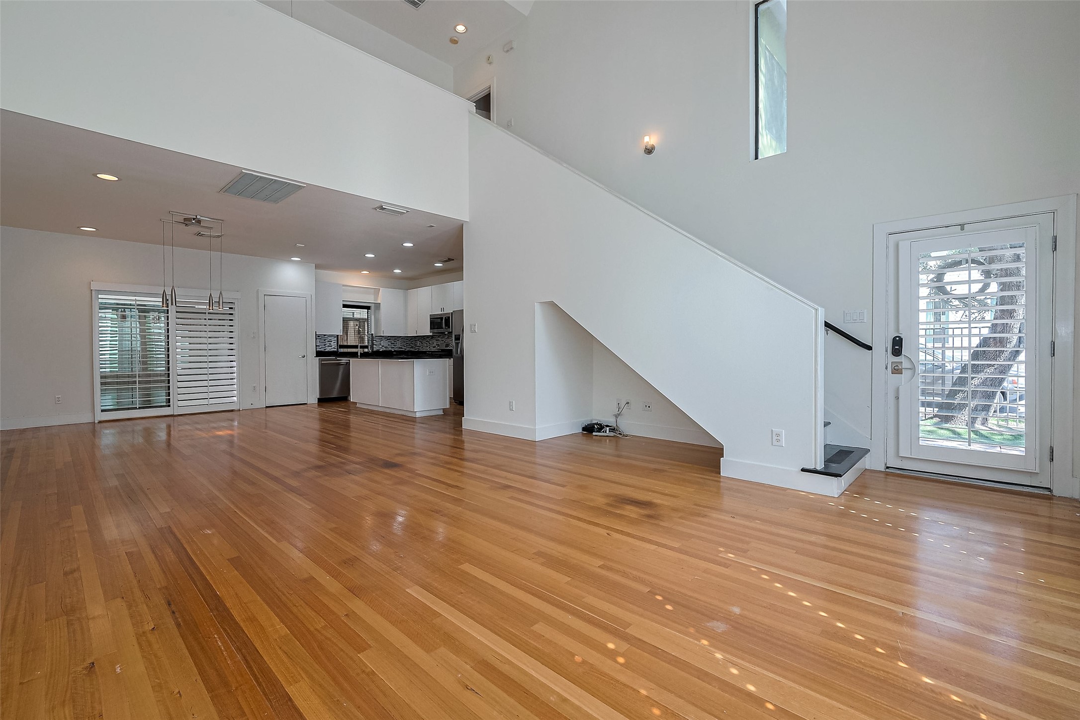 4331 Eigel Street Houston, TX 77007 - Photo 5 of 38 a view of empty room with wooden floor and windows