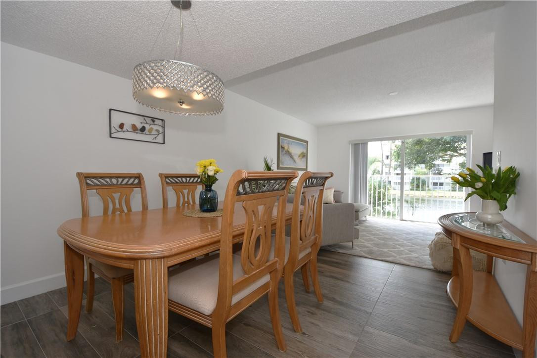 217 Riviera Circle, Unit 217 Weston, FL 33326 - Photo 13 of 58 a view of a dining room with furniture window and wooden floor