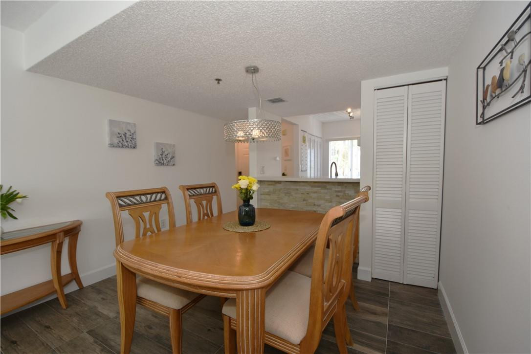 217 Riviera Circle, Unit 217 Weston, FL 33326 - Photo 14 of 58 a view of a dining room with furniture