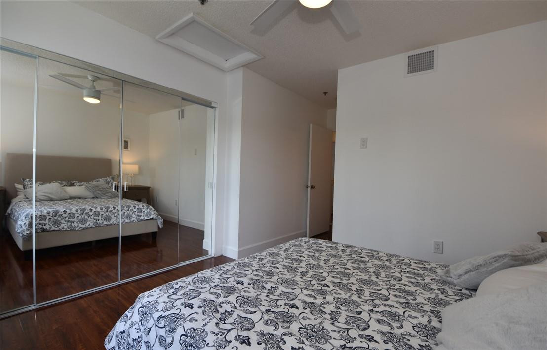 217 Riviera Circle, Unit 217 Weston, FL 33326 - Photo 26 of 58 a bedroom with a bed and a window