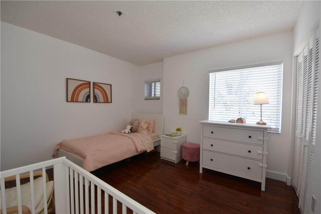 217 Riviera Circle, Unit 217 Weston, FL 33326 - Photo 35 of 58 a bedroom with two beds and a dresser