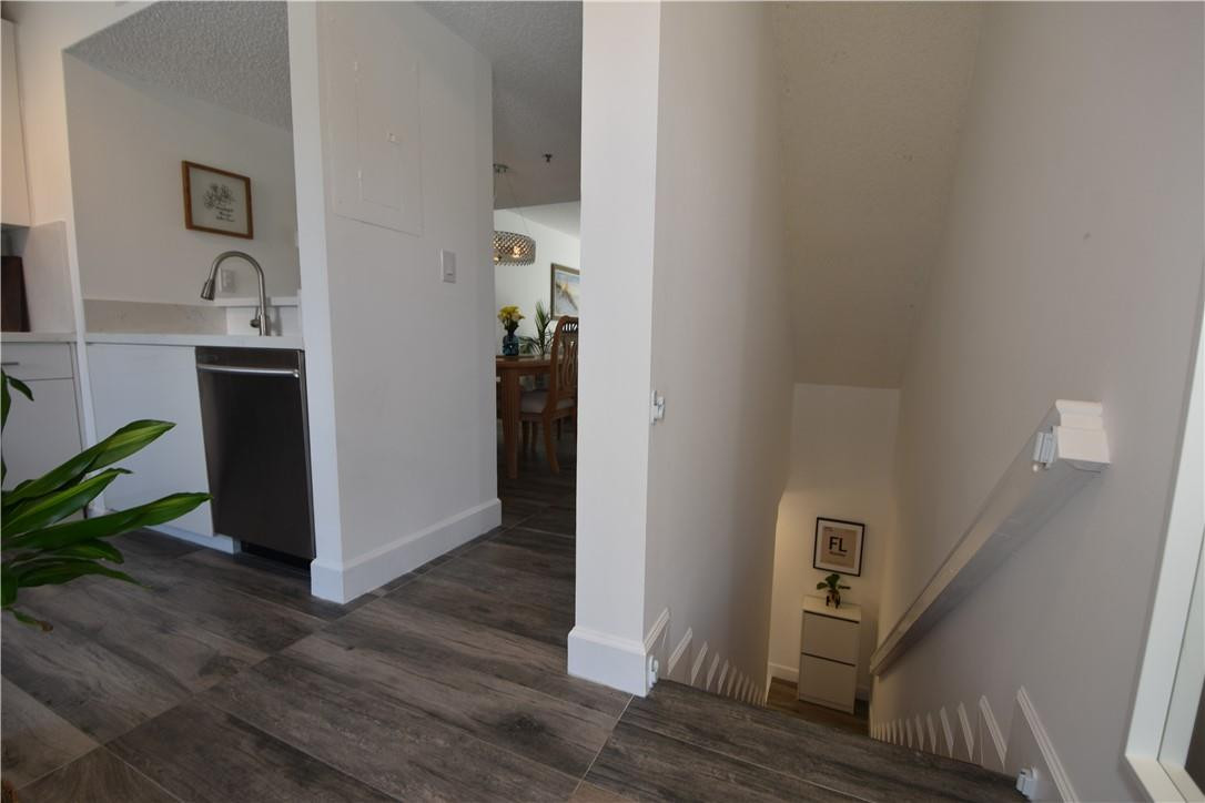 217 Riviera Circle, Unit 217 Weston, FL 33326 - Photo 39 of 58 a view of a kitchen from the hallway