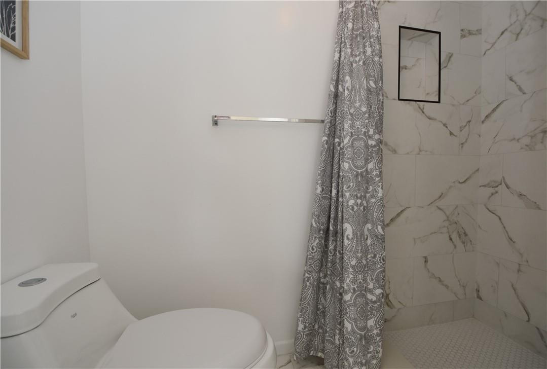 217 Riviera Circle, Unit 217 Weston, FL 33326 - Photo 43 of 58 a bathroom with a toilet and shower
