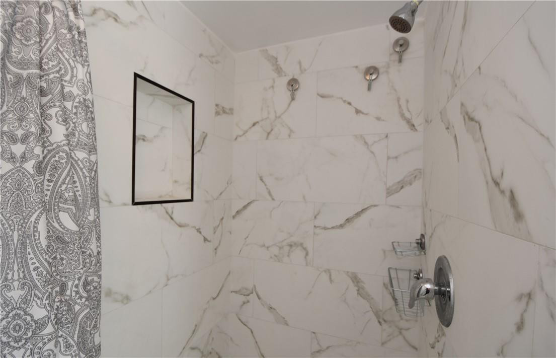 217 Riviera Circle, Unit 217 Weston, FL 33326 - Photo 44 of 58 a bathroom with a shower