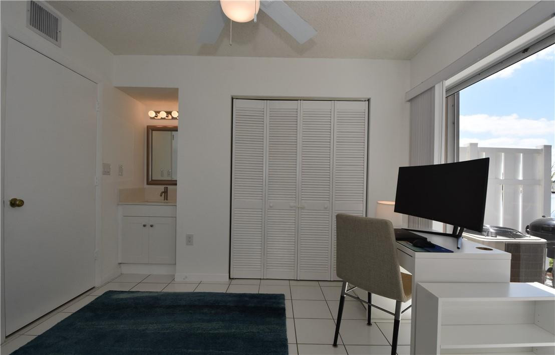 217 Riviera Circle, Unit 217 Weston, FL 33326 - Photo 45 of 58 a view of a livingroom with furniture and a flat screen tv