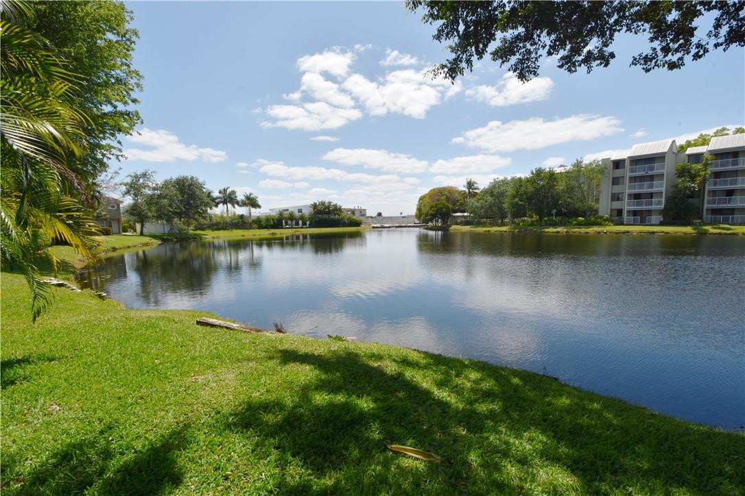 217 Riviera Circle, Unit 217 Weston, FL 33326 - Photo 47 of 58 a view of a lake with a city