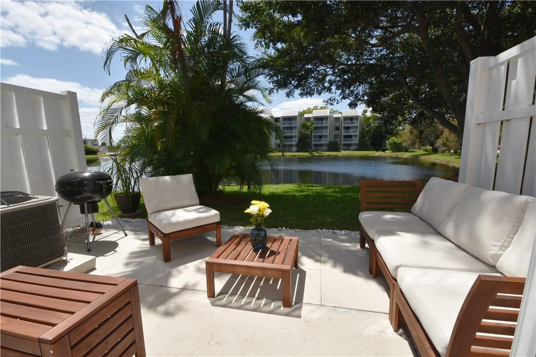 217 Riviera Circle, Unit 217 Weston, FL 33326 - Photo 51 of 58 a view of backyard of house with seating space