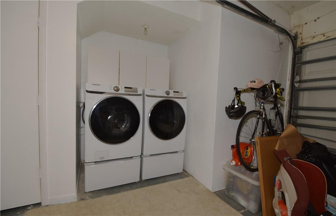 217 Riviera Circle, Unit 217 Weston, FL 33326 - Photo 52 of 58 a utility room with dryer washer and closet