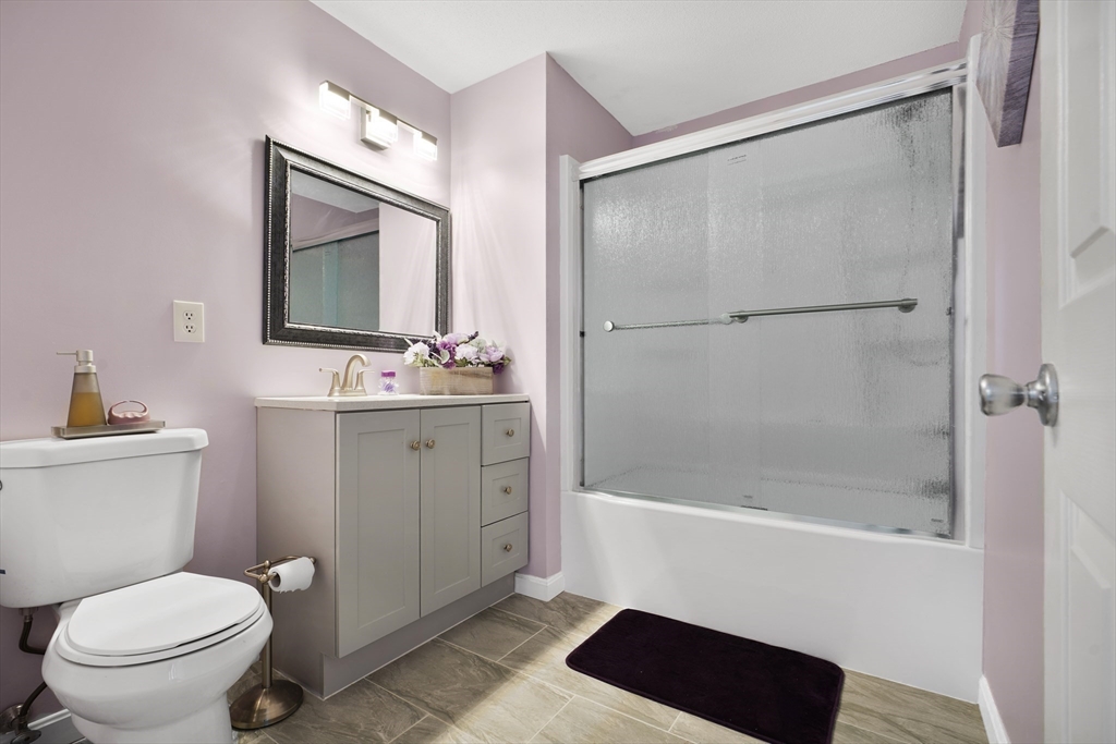 700 Shore Drive, Unit 813 Fall River, MA 02721 - Photo 16 of 29 a bathroom with a bathtub a sink a toilet a mirror and shower