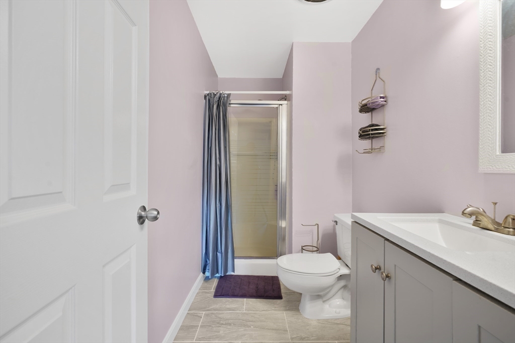 700 Shore Drive, Unit 813 Fall River, MA 02721 - Photo 22 of 29 a bathroom with a toilet a sink and shower
