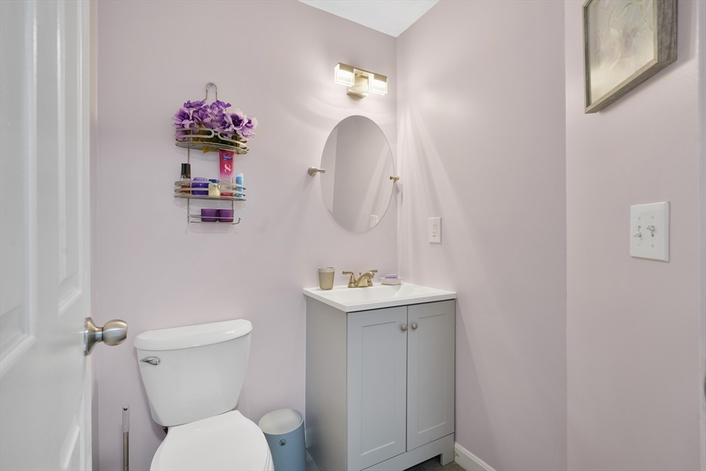 700 Shore Drive, Unit 813 Fall River, MA 02721 - Photo 23 of 29 a bathroom with a toilet sink vanity and mirror