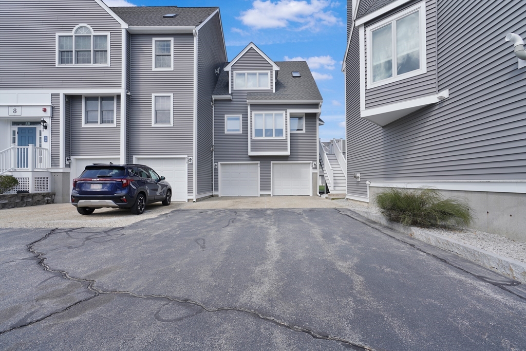700 Shore Drive, Unit 813 Fall River, MA 02721 - Photo 4 of 29 a car parked in front of a brick house