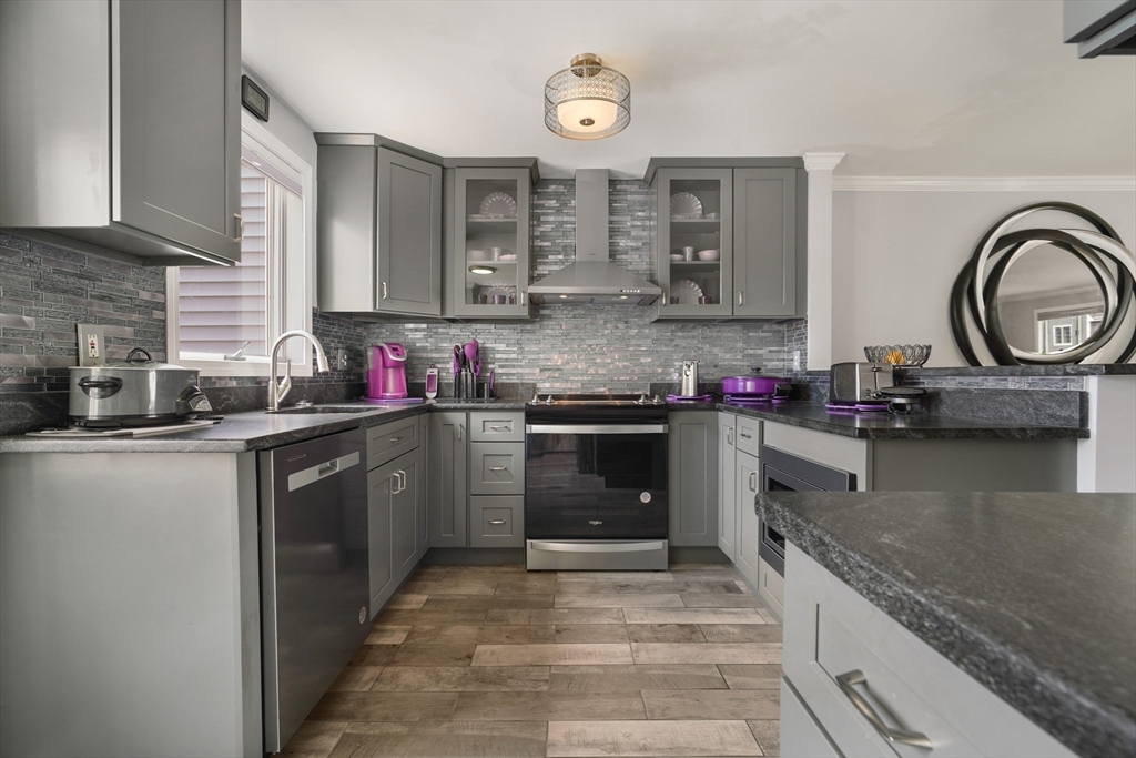 700 Shore Drive, Unit 813 Fall River, MA 02721 - Photo 5 of 29 a kitchen with stainless steel appliances granite countertop a sink stove and cabinets