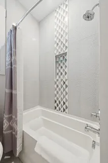 a view of a livingroom with workspace and a window