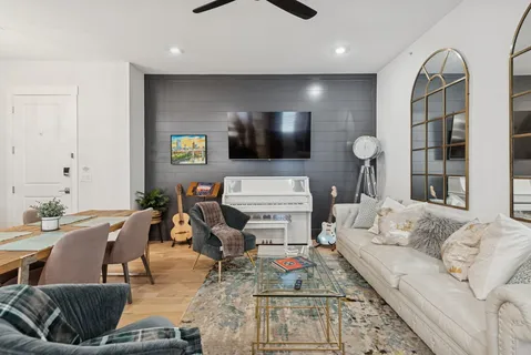 a living room with furniture and a flat screen tv