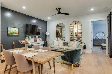 a work room with furniture and chandelier