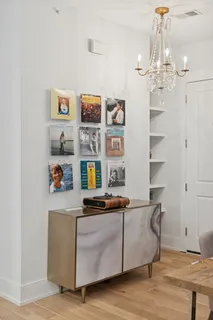 a bedroom with furniture and a chandelier