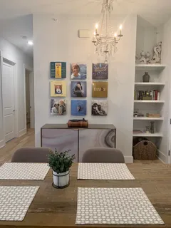 a bathroom with a granite countertop sink a toilet and a mirror