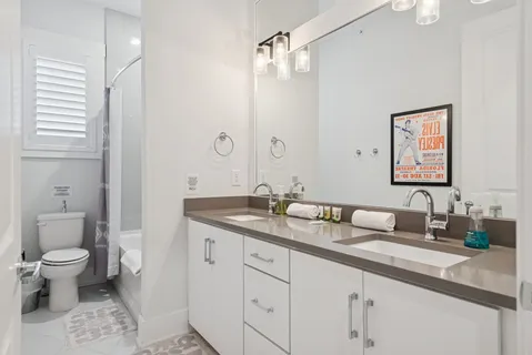 a bed room with bed and a chair