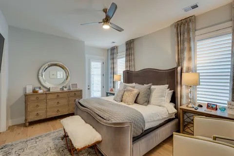 a bedroom with a bed and cabinets