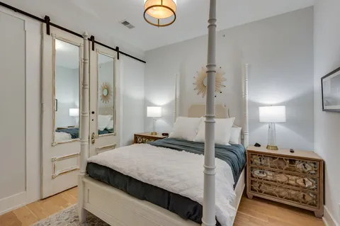 a living room with furniture and wall painting