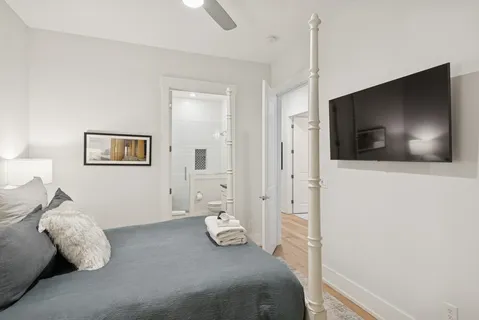 a view of a lake with a table and chairs