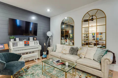 a living room with furniture and a flat screen tv