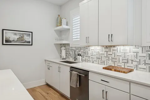 a kitchen with a sink and cabinets