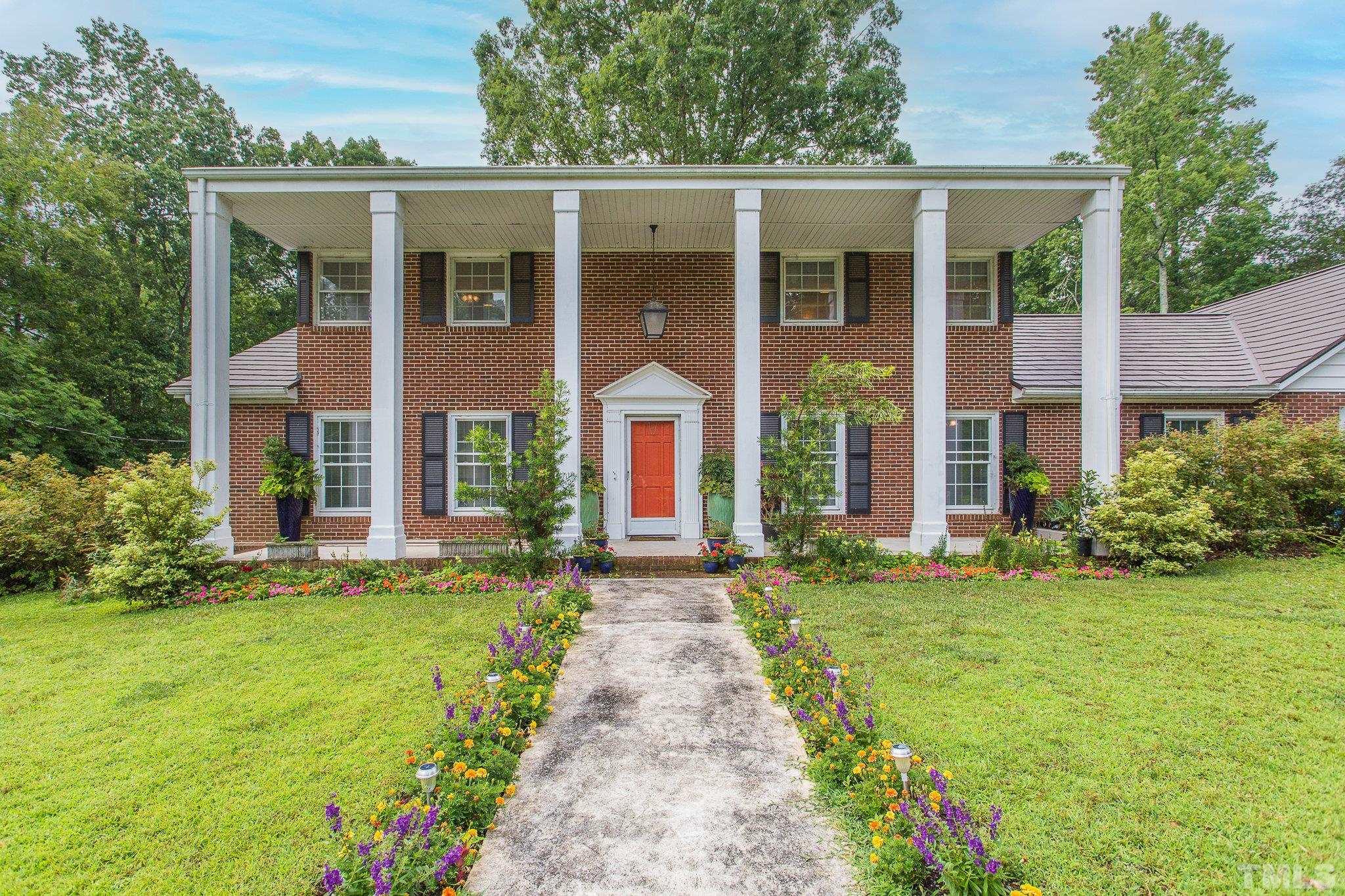 3213 Manor Ridge Drive Raleigh, NC 27603 - Photo 1 of 32 front view of a brick house with a yard