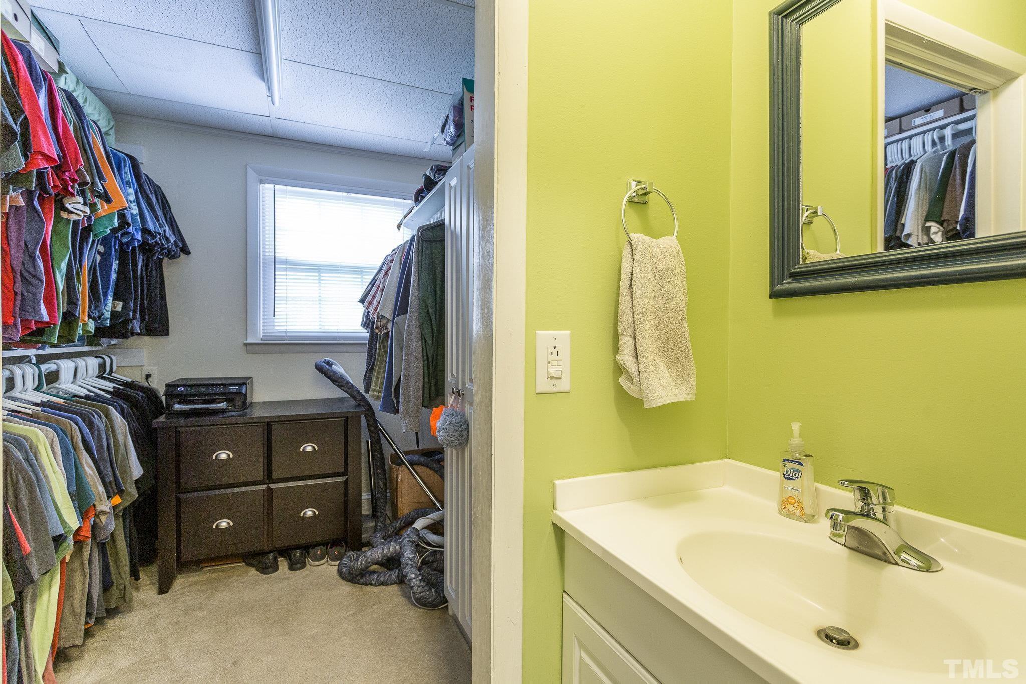 3213 Manor Ridge Drive Raleigh, NC 27603 - Photo 22 of 32 a bathroom with a sink and a mirror