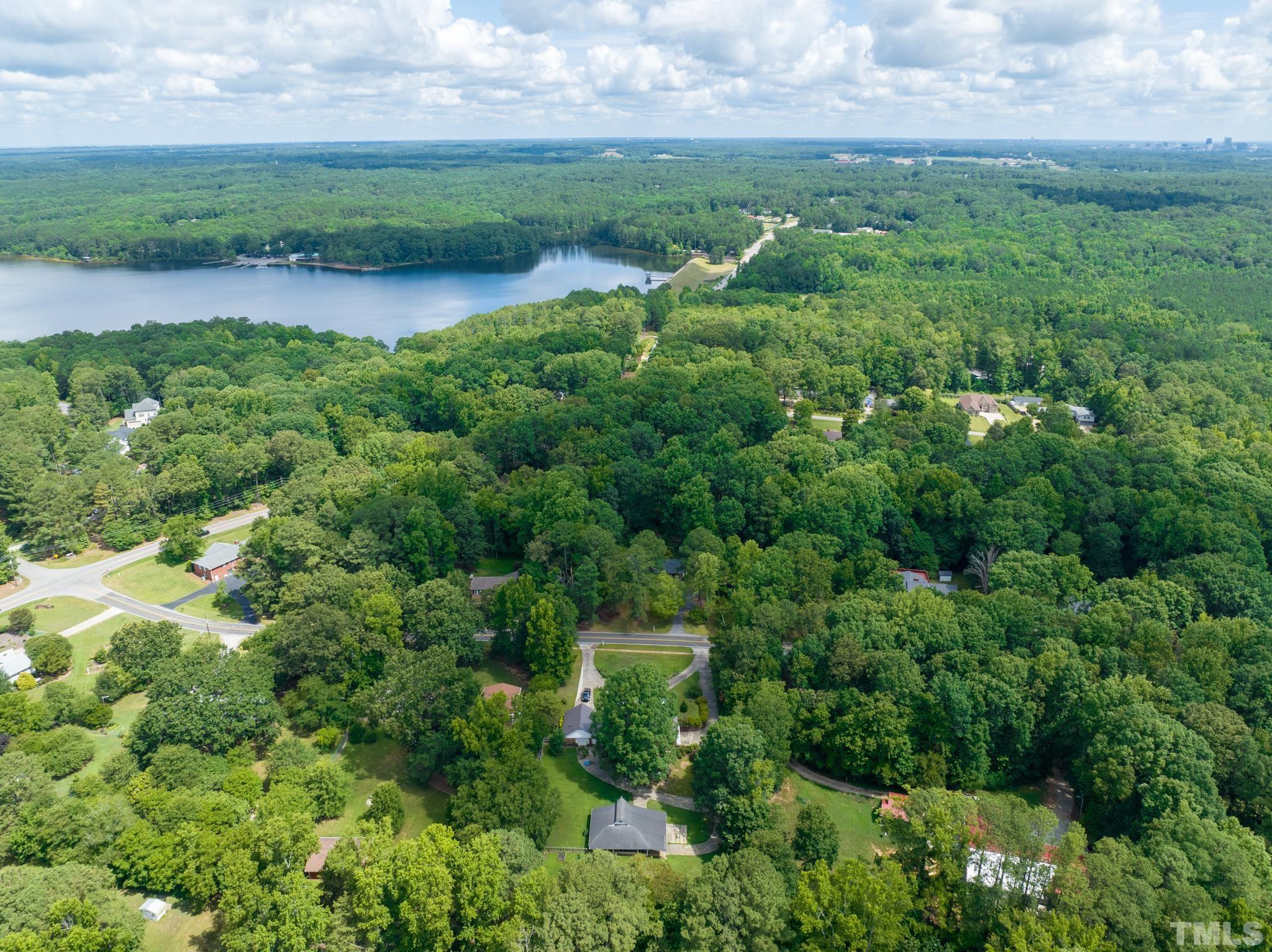 3213 Manor Ridge Drive Raleigh, NC 27603 - Photo 31 of 32 an aerial view of a houses with outdoor space and trees all around