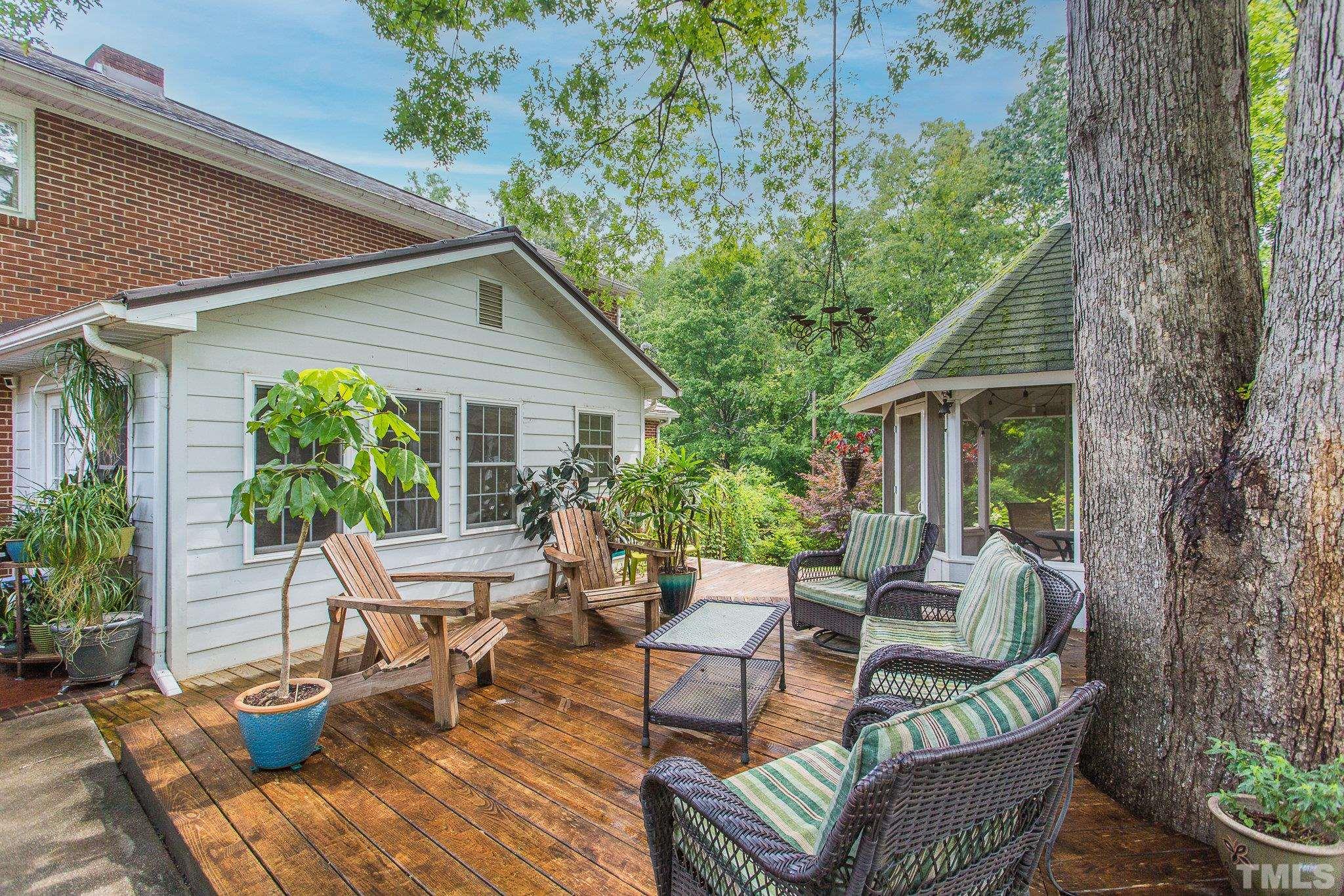 3213 Manor Ridge Drive Raleigh, NC 27603 - Photo 10 of 32 a view of a patio with couches chairs and a potted plant
